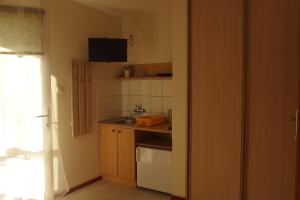 Kuchnia lub aneks kuchenny w obiekcie Patio Apartamenty i Pokoje