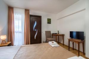 TV a/nebo společenská místnost v ubytování Casa ARBO