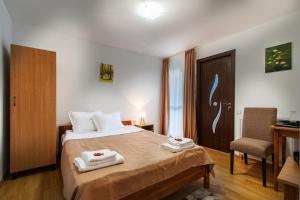 Postel nebo postele na pokoji v ubytování Casa ARBO