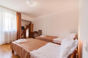 Postel nebo postele na pokoji v ubytování Casa ARBO