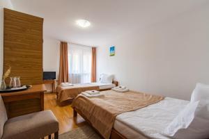 Postel nebo postele na pokoji v ubytování Casa ARBO
