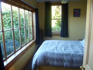 Postel nebo postele na pokoji v ubytování Hilltop Accommodation Catlins