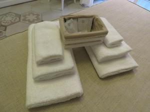 a pile of towels sitting on a bathroom floor at Le Ninfe Luxury Rooms in Naples +59 photos