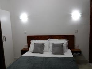 Postel nebo postele na pokoji v ubytování Beachfront Deluxe Apartment
