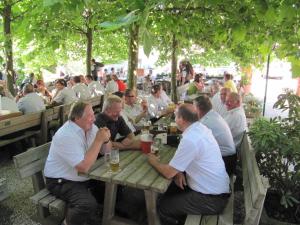 a group of men sitting at a picnic table at Gasthaus Marienhof in Kirchdorf am Inn +21 photos