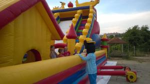 a group of children playing on a inflatable play structure at apartament Sea Star in Byala