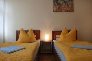 Säng eller sängar i ett rum på Altstadt-Pension-Potsdam