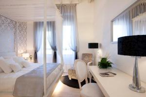 Postel nebo postele na pokoji v ubytování Hotel AF Pesquera