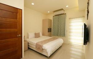 Voodi või voodid majutusasutuse 宜蘭樂活小屋 toas