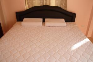Llit o llits en una habitació de Panna Kalong
