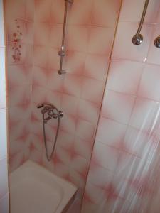 a bathroom with a shower with a tub and a sink at Omiš apartment on the beach in Omiš
