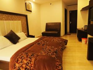 Hotel Amar Palace客房内的一张或多张床位