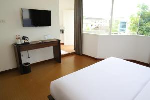 Katil atau katil-katil dalam bilik di Samara Resort