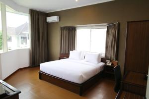 Katil atau katil-katil dalam bilik di Samara Resort