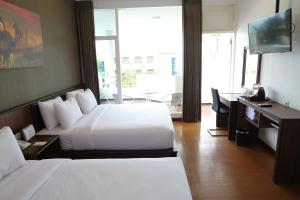 Katil atau katil-katil dalam bilik di Samara Resort