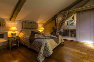 Letto o letti in una camera di Manoir des Chanterelles