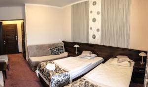 Postel nebo postele na pokoji v ubytování Hotel Rubbens & Monet