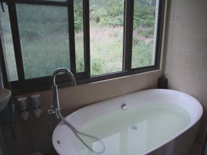 Vannituba majutusasutuses Peace Area Hot Spring Hotel
