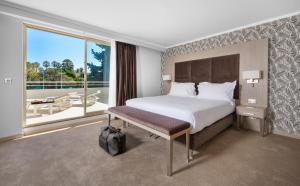 מיטה או מיטות בחדר ב-Juliana Hotel Cannes