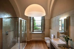 a bathroom with a shower and a sink and a toilet at Relais Villa del Borgo in Canelli