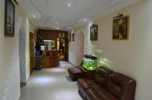 a living room with a couch and a fish tank at Private Residence Osobnyak in Odesa