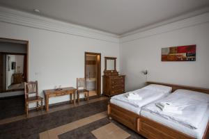 Posteľ alebo postele v izbe v ubytovaní Apartmány LAGUNA