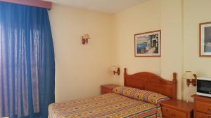 Posteľ alebo postele v izbe v ubytovaní Apartamentos Girasol II + 34 fotografií