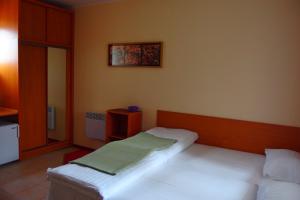 Łóżko lub łóżka w pokoju w obiekcie Patio Apartamenty i Pokoje