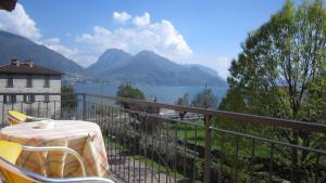 a balcony with a table and a view of a lake at Hotel Sole in San Siro