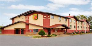 a large building with a fast food restaurant at Super 8 by Wyndham Richmond Airport VA in Sandston