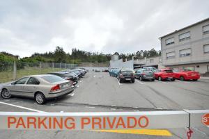 a parking lot with a bunch of cars parked at Hotel Montemar *** Superior in O Grove