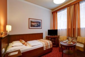 Telewizja i/lub zestaw kina domowego w obiekcie Hotel Radium Palace