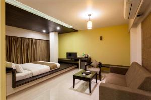 Hotel Rasika客房内的一张或多张床位