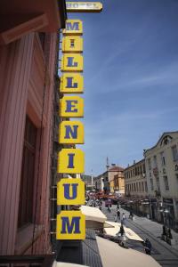 a sign for a hotel on the side of a building at Hotel Millenium in Bitola