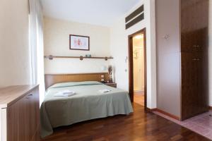 A bed or beds in a room at Residence Desenzano