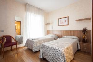 A bed or beds in a room at Residence Desenzano