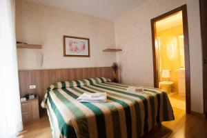 A bed or beds in a room at Residence Desenzano