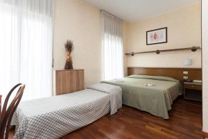 A bed or beds in a room at Residence Desenzano