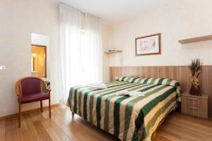 A bed or beds in a room at Residence Desenzano