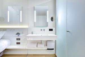 Katil atau katil-katil dalam bilik di R hotel experiences