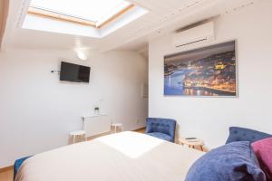 Postel nebo postele na pokoji v ubytování Porto 271 Mouzinho Apartamentos