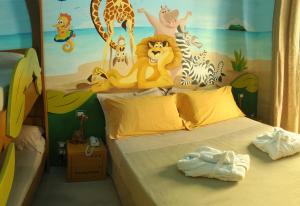 A bed or beds in a room at Mini Hotel