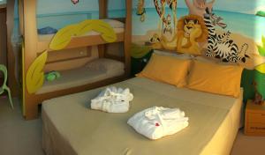 A bed or beds in a room at Mini Hotel