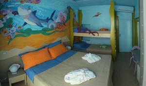 A bed or beds in a room at Mini Hotel