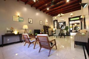 a lobby with chairs and a table in a room at The Egerton Melaka in Melaka