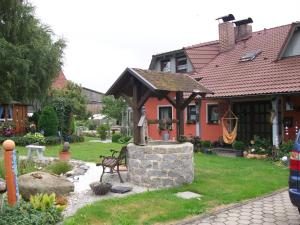a gazebo in the yard of a house at Ferienwohnung Haus Monika in Rötz