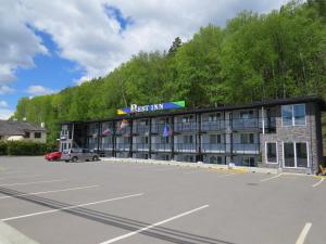 a parking lot in front of a building at Rest Inn in Terrace