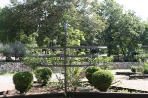 a bench in the middle of a garden at Agriturismo Mezzaluna in Málchina
