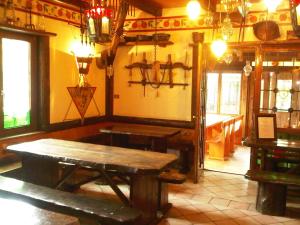 a room with a wooden table in a building at Agriturismo Mezzaluna in Málchina