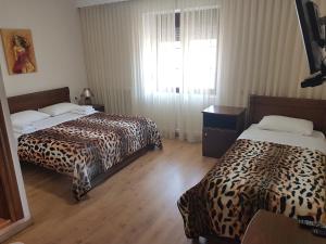 Posteľ alebo postele v izbe v ubytovaní Guest House Vaso